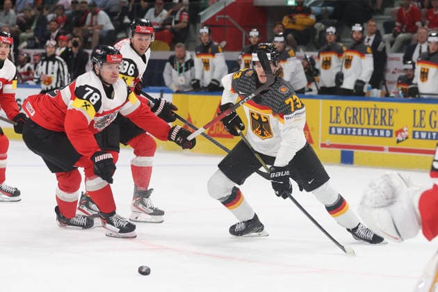 23 05 2026 Swiss Life Arena Zuerich , SWITZERLAND, Men Ice Hockey IIHF World Championship Zurich 2026 Group A AUT GER Thimo Nickl li,AUT against Lukas Reichel GER