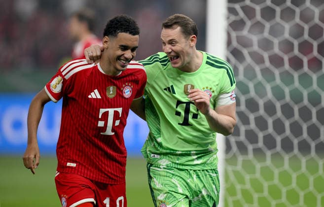 Football DFB Cup Final 2025 2026 in Berlin FC Bayern Muenchen VfB Stuttgart 23 05 2026 FC Bayern Muenchen celebrating after the victory and DFB Cup winner , from left , Jamal Musiala with goalkeeper Manuel Neuer