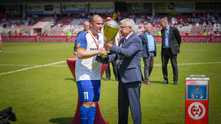 Soccer, Men, Season 2025 2026, Brandenburg State Cup, Final, Final day of the amateurs, FC Energie Cottbus vs VfB 1921 Krieschow, Saturday 23 05 2026, LEAG Energie Stadion Cottbus, In the picture Jens Kaden President FLB presents the cup to Andy Hebler Captain Krieschow Brandenburg Germany