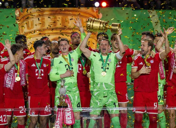 Soccer, Men, 2025 2026 season, 83 DFB Cup final, FC Bayern Munich VfB Stuttgart, award ceremony Bayern, goalkeeper Jonas Urbig Bayern Munich and goalkeeper Manuel Neuer Bayern Munich with trophy, 23 05 2026, Copyright: xMatthiasxKochx