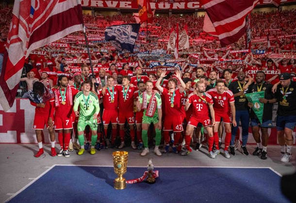 Soccer, Men, Season 2025 2026, 83 DFB Cup Final, FC Bayern Munich VfB Stuttgart, Winner photo Bayern with trophy in front of the fans in the east curve, 23 05 2026, Copyright: xMatthiasxKochx