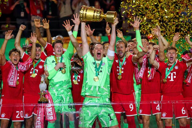23 05 2026, Football, 83 DFB Pokal Final,, FC Bayern München VfB Stuttgart, Olympioastadion Berlin, Season 2025 2026 FC Bayern München is cup winner after the 3 0 victory Cup presentation ceremony Goalkeeper Manuel Neuer FC Bayern Muenchen 01 with the cup in his hand DFB regulations prohibit any use of photographs as image sequences and or quasi video Berlin Germany
