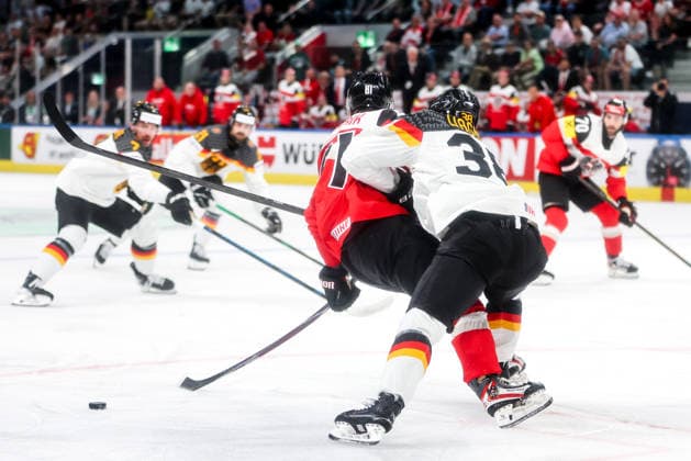 Ice hockey, Eishockey - IIHF WC 2026 ZURICH,SWITZERLAND,23.MAY.26 - ICE HOCKEY - IIHF Ice Hockey World Championship, WM, Weltmeisterschaft 2026, group stage, Austria vs Germany. Image shows Leon Kolarik (AUT) and Fabio Wagner (GER).  GEPAxpictures xMaticxKlansek
