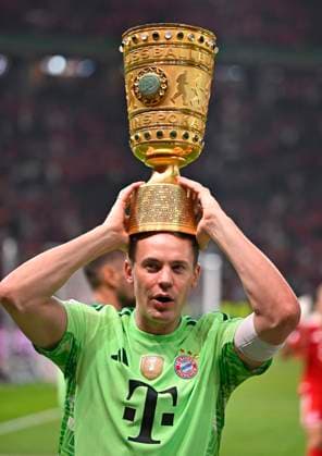 23 05 2026, Football DFB Pokal 2025 2026, Final, FC Bayern Munich VfB Stuttgart, at Olympiastadion Berlin Goalkeeper Manuel Neuer FC Bayern Munich lifts the cup DFL and DFB regulations prohibit any use of photographs as image sequences and or quasi video