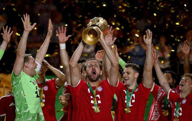 Football DFB Cup Final 2025 2026 in Berlin FC Bayern Muenchen VfB Stuttgart 23 05 2026 Winner FC Bayern Muenchen cheers on the podium from left , goalkeeper Manuel Neuer, Harry Kane with the DFB Cup, Josip Stanisic , Joshua Kimmich