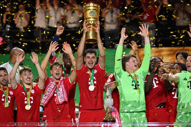 after the end of the match cup handover FC Bayern celebrate victory DFB Cup Aleksandar Pavlovic FC Bayern Muenchen FCB 45 Goalkeeper Jonas Urbig FC Bayern Muenchen FCB 40 Lennart Karl Bayern Muenchen FCB 42 Tom Bischof FC Bayern Muenchen FCB 20 83 DFB Cup Final FC Bayern Muenchen FCB vs VFB Stuttgart Olympiastadion Berlin 23 05 2026 DFL REGULATIONS PROHIBIT ANY USE OF PHOTOGRAPHS AS IMAGE SEQUENCES AND OR QUASI VIDEO 83 DFB Cup Final FC Bayern Muenchen FCB vs VFB Stuttgart