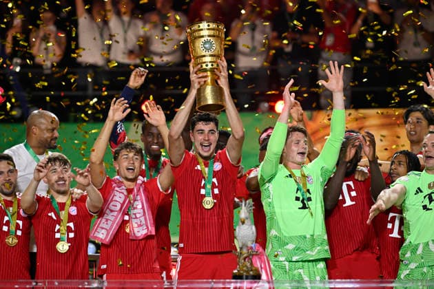 after the end of the match cup handover FC Bayern celebrate victory DFB Cup Aleksandar Pavlovic FC Bayern Muenchen FCB 45 Goalkeeper Jonas Urbig FC Bayern Muenchen FCB 40 Lennart Karl Bayern Muenchen FCB 42 Tom Bischof FC Bayern Muenchen FCB 20 83 DFB Cup Final FC Bayern Muenchen FCB vs VFB Stuttgart Olympiastadion Berlin 23 05 2026 DFL REGULATIONS PROHIBIT ANY USE OF PHOTOGRAPHS AS IMAGE SEQUENCES AND OR QUASI VIDEO 83 DFB Cup Final FC Bayern Muenchen FCB vs VFB Stuttgart