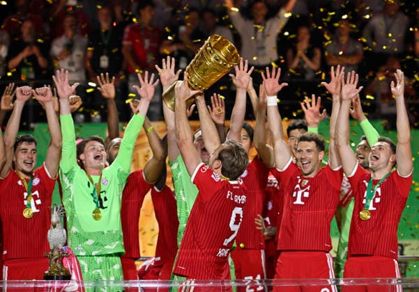 after the end of the match cup handover FC Bayern celebrate victory DFB Cup Harry Kane FC Bayern Muenchen FCB 09 Goalkeeper Jonas Urbig FC Bayern Muenchen FCB 40 Leon Goretzka FC Bayern Muenchen FCB 08 Goalkeeper Jonas Urbig FC Bayern Muenchen FCB 40 Aleksandar Pavlovic FC Bayern Muenchen FCB 45 Josip Stanisic FC Bayern Muenchen FCB 44 83 DFB Cup Final FC Bayern Muenchen FCB vs VFB Stuttgart Olympiastadion Berlin 23 05 2026 DFL REGULATIONS PROHIBIT ANY USE OF PHOTOGRAPHS AS IMAGE SEQUENCES AND OR QUASI VIDEO 83 DFB Cup Final FC Bayern Muenchen FCB vs VFB Stuttgart