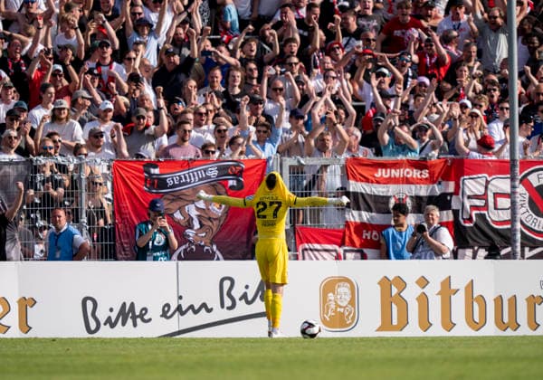 Arne Schulz Viktoria Koeln, 27 saves the decisive penalty kick from Dejan Galjen Fortuna Koeln, 24 and thus secures the cup victory Here he is celebrated by the fans in front of the fan curve SC Fortuna Köln vs Viktoria Köln 23 05 2026 Football, Bitburger Pokalfinale 2026, GER, Sportpark Höhenberg, Cologne Copyright: HMBxMedia xMarcoxBader