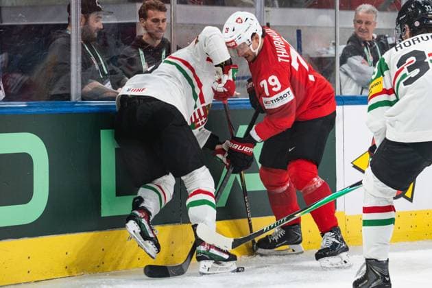 ZURICH, ZURICH - MAY 23: Calvin Thürkauf of Switzerland protects the puck against Hungary players during the 2026 IIHF World Championship, WM, Weltmeisterschaft Preliminary Round Group A match between Switzerland and Hungary at Swiss Life Arena on May 23, 2026 in Zurich, Zurich, Switzerland.  Copyright: xLivioxBaeriswylx xSPPx Sportspressphoto_152950