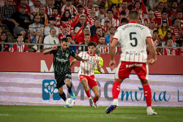 Toni Morente Elche CF and Joel Roca Girona FC battle for the ball during a La Liga EA Sports match between Girona FC and Elche CF at Estadi Municipal de Montilivi in Girona, , Spain, on May 23 2026 Photo by Felipe Mondino Copyright: x@FELIPExMONDINOx