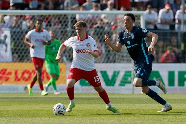 from left to right Philipp Ochs Würzburger Kickers and Samuel Althaus TSV 1860 Munich , in the final of the Bavarian Toto Cup between FC Würzburger Kickers and TSV 1860 Munich at Stadion am Dallenberg, Würzburg, Germany, on May 23, 2026 Copyright: HMBxMedia xHeikoxBecker