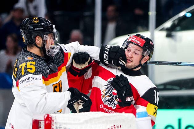 Ice hockey, Eishockey - IIHF WC 2026 ZURICH,SWITZERLAND,23.MAY.26 - ICE HOCKEY - IIHF Ice Hockey World Championship, WM, Weltmeisterschaft 2026, group stage, Austria vs Germany. Image shows Samuel Dove-McFalls (GER) and Dominic Zwerger (AUT).  GEPAxpictures xMaticxKlansek