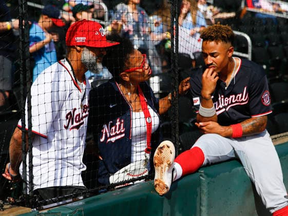 Second baseman Nasim Nunez 26 of the Washington Nationals talks to fans during the rain delay in the middle of the game against the Atlanta Braves at Truist Park on Saturday, May 23, 2026 in Atlanta, Georgia.  ATL20260523106 MikexZarrilli