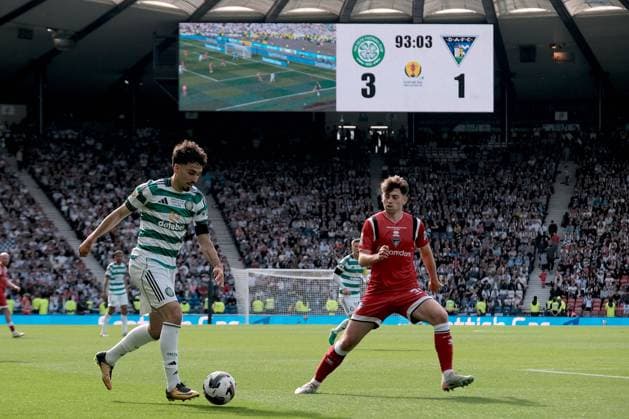 UK: Celtic v Dunfermline, Scottish Cup Final at Barclays Hampden, Glasgow, Scotland on 23 May 2026: Pictured: Sebastian Tounekti (Celtic) takes on Josh Cooper (Dunfermline Athletic) as the big screen shows the score in the 93rd minute Glasgow Barclays Hampden Scotland Copyright: xAlexxToddx