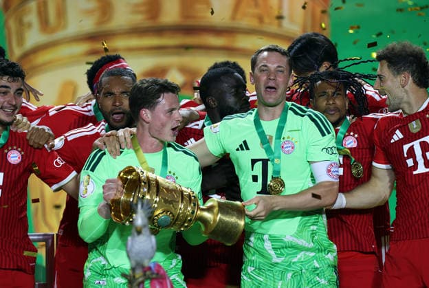 Football, Men, DFB Cup Final, Season 2025 2026, FC Bayern Munich VFB Stuttgart, Olympiastadion Berlin The FC Bayern Munich team celebrates winning the DFB Cup here after the match, in the picture Jonas Urbig FC Bayern Munich left with the cup and Manuel Neuer FC Bayern Munich right celebrating DFB, DFL regulations prohibit any use of photographs as image sequences and or quasi video