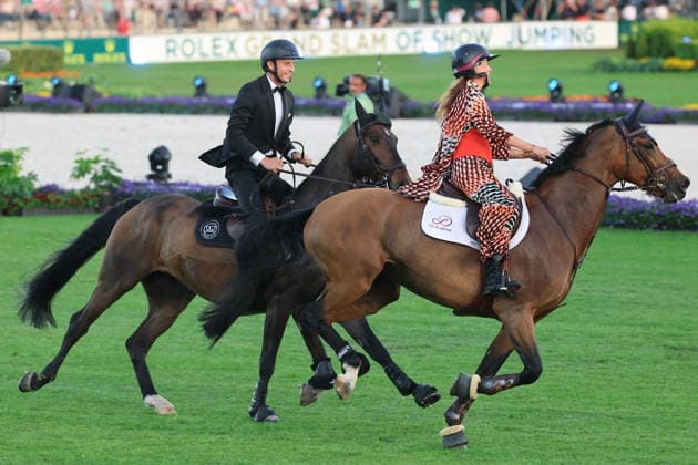 Richard Vogel and Luciana Diniz together in Bond Stunt Feeling over the obstacles, concert horse symphony, supporting program, motto of the evening James Bond, World Equestrian Festival, TSCHIO Aachen 2026, TSCHIO instead of CHIO 2026, Aachener Soers, 22 to 24 May 2026, equestrian sport, 23 05 2026, Aachener Soers Germany