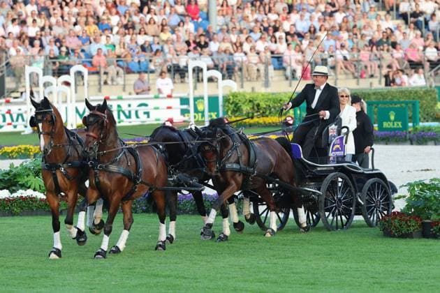 Britt Ekland took a seat on the coach box behind the World Champion Boyd Exell Ð the legendary Bond Girl from the film ÒThe Man with the Golden GunÓ , concert horse symphony, supporting program, motto of the evening James Bond, World Equestrian Festival, TSCHIO Aachen 2026, TSCHIO instead of CHIO 2026, Aachener Soers, 22 to 24 May 2026, equestrian sport, 23 05 2026, Aachener Soers Aachen Germany
