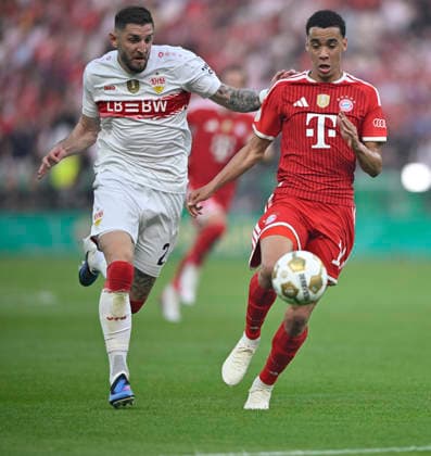 duel, action Jeff Chabot VfB Stuttgart 24 vs Jamal Musiala FC Bayern Muenchen FCB 10 83 DFB Pokalfinale FC Bayern Muenchen FCB vs VFB Stuttgart Olympiastadion Berlin 23 05 2026 DFL REGULATIONS PROHIBIT ANY USE OF PHOTOGRAPHS AS IMAGE SEQUENCES AND OR QUASI VIDEO 83 DFB Pokalfinale FC Bayern Muenchen FCB vs VFB Stuttgart