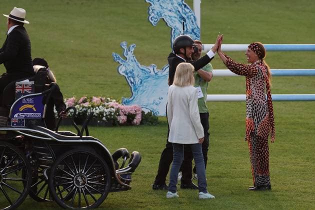 Britt Ekland Ð the legendary Bond Girl from the film ÒThe Man with the Golden GunÓ with Richard Vogel and Luciana Diniz high-fiving , Concert Horse Symphony, supporting program, motto of the evening James Bond, World Equestrian Festival, TSCHIO Aachen 2026, TSCHIO instead of CHIO 2026, Aachener Soers, 22 to 24 May 2026, equestrian sport, 23 05 2026, Aachener Soers Aachen Germany