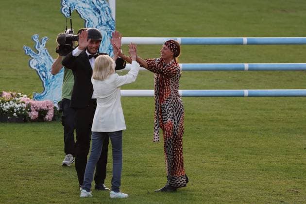 Britt Ekland Ð the legendary Bond Girl from the film ÒThe Man with the Golden GunÓ with Richard Vogel and Luciana Diniz high-fiving , Concert Horse Symphony, supporting program, motto of the evening James Bond, World Equestrian Festival, TSCHIO Aachen 2026, TSCHIO instead of CHIO 2026, Aachener Soers, 22 to 24 May 2026, equestrian sport, 23 05 2026, Aachener Soers Aachen Germany