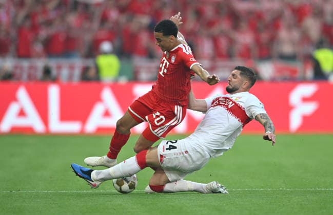Jamal Musiala FC Bayern Muenchen FCB 10 vs Jeff Chabot VfB Stuttgart 24 83 DFB Pokalfinale FC Bayern Muenchen FCB vs VFB Stuttgart Olympiastadion Berlin 23 05 2026 DFL REGULATIONS PROHIBIT ANY USE OF PHOTOGRAPHS AS IMAGE SEQUENCES AND OR QUASI VIDEO 83 DFB Pokalfinale FC Bayern Muenchen FCB vs VFB Stuttgart