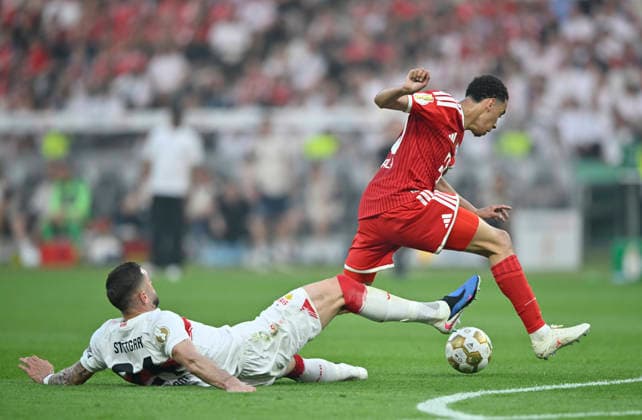 duel, action Jeff Chabot VfB Stuttgart 24 vs Jamal Musiala FC Bayern Muenchen FCB 10 83 DFB Pokalfinale FC Bayern Muenchen FCB vs VFB Stuttgart Olympiastadion Berlin 23 05 2026 DFL REGULATIONS PROHIBIT ANY USE OF PHOTOGRAPHS AS IMAGE SEQUENCES AND OR QUASI VIDEO 83 DFB Pokalfinale FC Bayern Muenchen FCB vs VFB Stuttgart