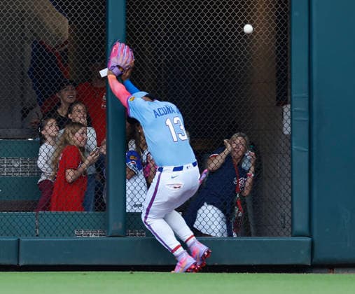 Right fielder Ronald Acuna, Jr. 13 of the Atlanta Braves misplays a ball that hit the outfield wall during the game against the Washington Nationals at Truist Park on Saturday, May 23, 2026 in Atlanta, Georgia.  ATL20260523115 MikexZarrilli