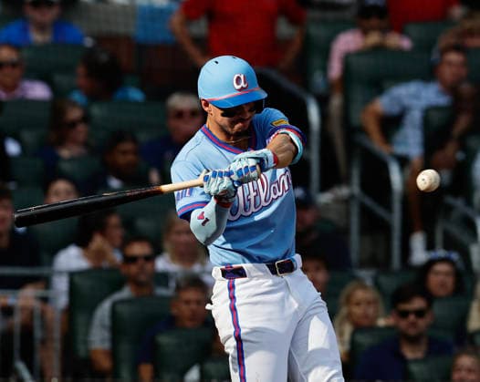 Shortstop Mauricio Dubon 14 of the Atlanta Braves swings in the fifth inning during the game against the Washington Nationals at Truist Park on Saturday, May 23, 2026 in Atlanta, Georgia.  ATL20260523128 MikexZarrilli