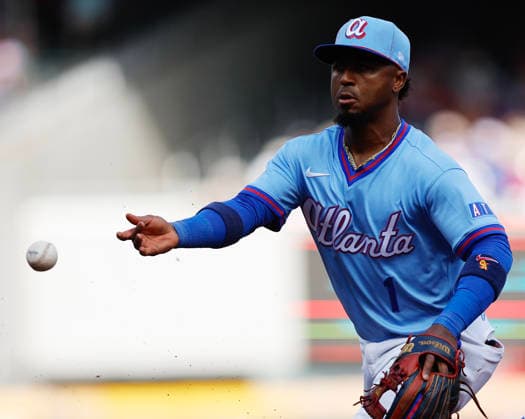 Second baseman Ozzie Albies 1 of the Atlanta Braves flips the ball to first base in the fifth inning during the game against the Washington Nationals at Truist Park on Saturday, May 23, 2026 in Atlanta, Georgia.  ATL20260523130 MikexZarrilli