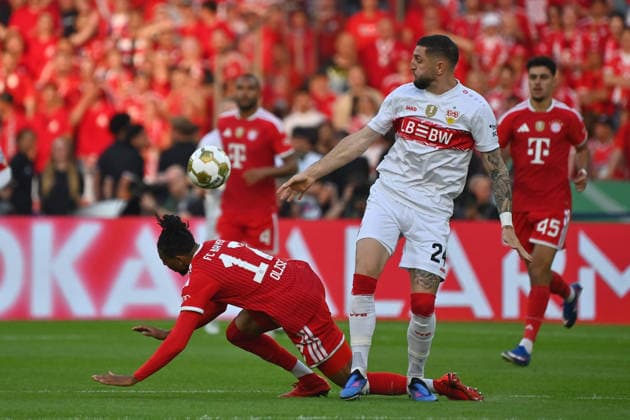 Jeff CHABOT VFB Stuttgart , action,duel against Michael OLISE Bayern Muenchen Fussball 83 DFB Pokal Final 2026 FC Bayern Muenchen VfB Stuttgart 3 0 am 23 05 2026, Olympiastadion in Berlin DFL DFB regulations prohibit any use of photographs as image sequences and or quasi video