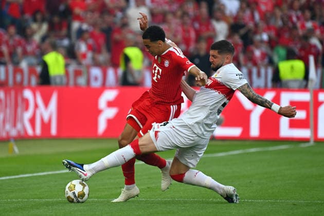 Jeff CHABOT VFB Stuttgart , action,duel against Jamal MUSIALA Bayern Muenchen Fussball 83 DFB Pokal Final 2026 FC Bayern Muenchen VfB Stuttgart 3 0 am 23 05 2026, Olympiastadion in Berlin DFL DFB regulations prohibit any use of photographs as image sequences and or quasi video