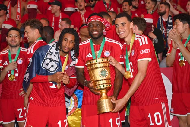from left Michael OLISE Bayern Muenchen , Alphonso DAVIES Bayern Muenchen , Jamal MUSIALA Bayern Muenchen with trophy,Cup,Trophaee, Jubel,Freude,Begeisterung, Siegerehrung Fussball 83 DFB Pokal Finale 2026 FC Bayern Muenchen VfB Stuttgart 3 0 am 23 05 2026, Olympiastadion in Berlin DFL DFB regulations prohibit any use of photographs as image sequences and or quasi video
