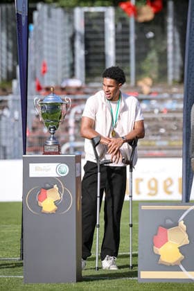 23 05 2026, xsefx, Football, Final Bitburger Pokal, FC Viktoria Köln S C Fortuna Koeln, Sportpark Höhenberg, Season 2025 2026 Top scorer iim Bitburger Pokal 2026 Benedikt Zank, striker of Viktoria Köln on crutches DFB regulations prohibit any use of photographs as image sequences and or quasi video Photo xSabinexEffgenxPressefotoKochx Nordrhein Westfalen Germany