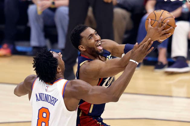 Cleveland Cavaliers Donovan Mitchell (45) is fouled by New York Knicks OG Anunoby (8) during the first quarter of their Eastern Conference Final game in Cleveland, Ohio Saturday May 23, 2026.  CLE20260523107 AARONxJOSEFCZYK