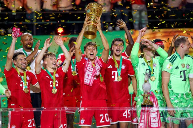 23 05 2026, Football, 83 DFB Pokal Final,, FC Bayern München VfB Stuttgart, Olympioastadion Berlin, Season 2025 2026 FC Bayern München is cup winner after the 3 0 victory Cup presentation ceremony Goalkeeper Tom Bischof FC Bayern Muenchen 20 with the cup in his hand DFB regulations prohibit any use of photographs as image sequences and or quasi video Berlin Germany