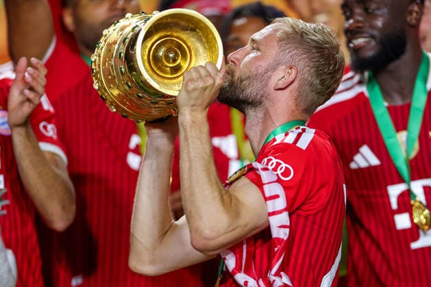 23 05 2026, Football, 83 DFB Cup Final, FC Bayern Munich VfB Stuttgart, Olympioastadion Berlin, Season 2025 2026 FC Bayern Munich is cup winner after the 3 0 victory Winners celebration Konrad Laimer FC Bayern Muenchen 27 with the cup in his hand DFB regulations prohibit any use of photographs as image sequences and or quasi video Berlin Germany