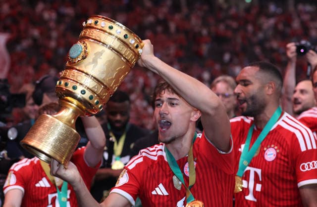 Football, Men, DFB Cup Final, Season 2025 2026, FC Bayern Munich VFB Stuttgart, Olympiastadion Berlin The FC Bayern Munich team celebrates winning the DFB Cup here after the game, in the picture Tom Bischof FC Bayern Munich with the pot in his hands DFB, DFL regulations prohibit any use of photographs as image sequences and or quasi video