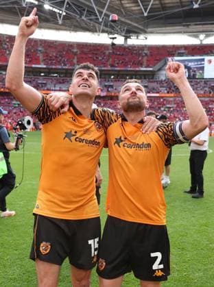 John Egan and Lewis Coyle of Hull City point to the sky as they celebrate Hull City v Middlesbrough, EFL Sky Bet Championship, Play-Off Final, Football, Wembley Stadium, London, UK - 23 May 2026London Wembley Stadium United Kingdom EDITORIAL USE ONLY No use with unauthorised audio, video, data, fixture lists, club league logos or live services. Online in-match use limited to 120 images, no video emulation. No use in betting, games or single club league player publications. Copyright: xKieranxMcManus Shutterstockx 16887313il