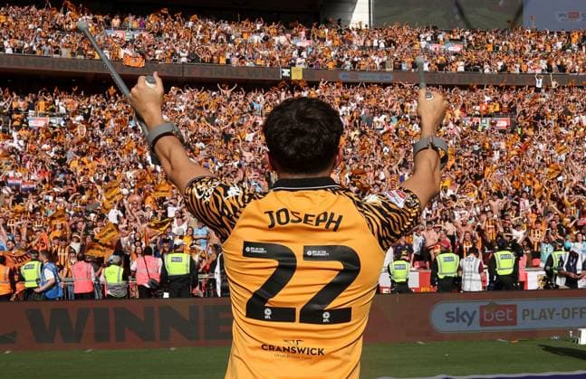 Hull City fans celebrate as Kyle Joseph of Hull City waves his crutches Hull City v Middlesbrough, EFL Sky Bet Championship, Play-Off Final, Football, Wembley Stadium, London, UK - 23 May 2026London Wembley Stadium United Kingdom EDITORIAL USE ONLY No use with unauthorised audio, video, data, fixture lists, club league logos or live services. Online in-match use limited to 120 images, no video emulation. No use in betting, games or single club league player publications.  Copyright: xKieranxMcManus Shutterstockx 16887313jb