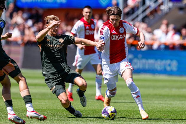 2026-05-24 AFC Ajax v FC Utrecht - Dutch Eredivisie Play-Offs VOLENDAM, NETHERLANDS - MAY 24: Mika Godts of AFC Ajax battles for possession with Dani de Wit of FC Utrecht during the Dutch Eredivisie Play-Offs match between AFC Ajax and FC Utrecht at Kras Stadion on May 24, 2026 in Volendam, Netherlands. Volendam Kras Stadion Netherlands Content not available for redistribution in The Netherlands directly or indirectly through any third parties. Copyright: xBenxGalx
