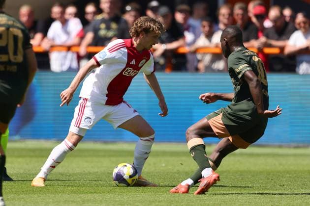 VOLENDAM , 24-05-2026 , Kras Stadium, season 2025 2026 , Play-offs for European football , Dutch Eredivisie Football . Match between Ajax and FC Utrecht , picture shows Ajax player Mika Godts , FC Utrecht player Yoann Cathline Ajax - Utrecht (play off)  x203934658x Copyright: