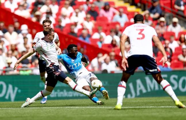 Adama Sidibeh of Stockport County in action against George Johnston of Bolton Wanderers Bolton Wanderers v Stockport County, EFL Sky Bet League One, Play-Off Final, Football, Wembley Stadium, London, UK - 24 May 2026London Wembley Stadium United Kingdom EDITORIAL USE ONLY No use with unauthorised audio, video, data, fixture lists, club league logos or live services. Online in-match use limited to 120 images, no video emulation. No use in betting, games or single club league player publications.  Copyright: xSimonxDael Shutterstockx 16889811el