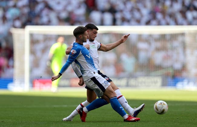 Oliver Norwood of Stockport County and Ruben Rodrigues of Bolton Wanderers Bolton Wanderers v Stockport County, EFL Sky Bet League One, Play-Off Final, Football, Wembley Stadium, London, UK - 24 May 2026London Wembley Stadium United Kingdom EDITORIAL USE ONLY No use with unauthorised audio, video, data, fixture lists, club league logos or live services. Online in-match use limited to 120 images, no video emulation. No use in betting, games or single club league player publications.  Copyright: xAndrewxFosker Shutterstockx 16889807aa