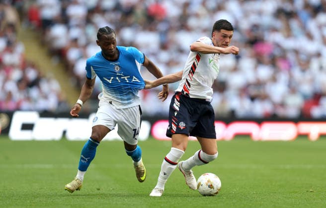 Xavier Simons of Bolton Wanderers and Tayo Edun of Stockport County Bolton Wanderers v Stockport County, EFL Sky Bet League One, Play-Off Final, Football, Wembley Stadium, London, UK - 24 May 2026London Wembley Stadium United Kingdom EDITORIAL USE ONLY No use with unauthorised audio, video, data, fixture lists, club league logos or live services. Online in-match use limited to 120 images, no video emulation. No use in betting, games or single club league player publications.  Copyright: xAndrewxFosker Shutterstockx 16889807an