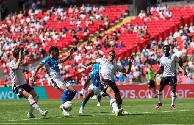 Odin Bailey of Stockport County is blocked by Chris Forino-Joseph of Bolton Wanderers Bolton Wanderers v Stockport County, EFL Sky Bet League One, Play-Off Final, Football, Wembley Stadium, London, UK - 24 May 2026London Wembley Stadium United Kingdom EDITORIAL USE ONLY No use with unauthorised audio, video, data, fixture lists, club league logos or live services. Online in-match use limited to 120 images, no video emulation. No use in betting, games or single club league player publications.  Copyright: xAndrewxFosker Shutterstockx 16889807bl
