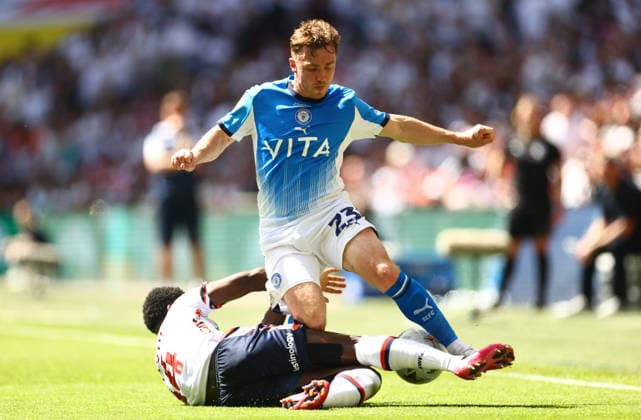 Ben Osborn of Stockport County tackled by Jordi Osei-Tutu of Bolton Wanderers Bolton Wanderers v Stockport County, EFL Sky Bet League One, Play-Off Final, Football, Wembley Stadium, London, UK - 24 May 2026London Wembley Stadium United Kingdom EDITORIAL USE ONLY No use with unauthorised audio, video, data, fixture lists, club league logos or live services. Online in-match use limited to 120 images, no video emulation. No use in betting, games or single club league player publications.  Copyright: xJamesxMarsh Shutterstockx 16889809ca
