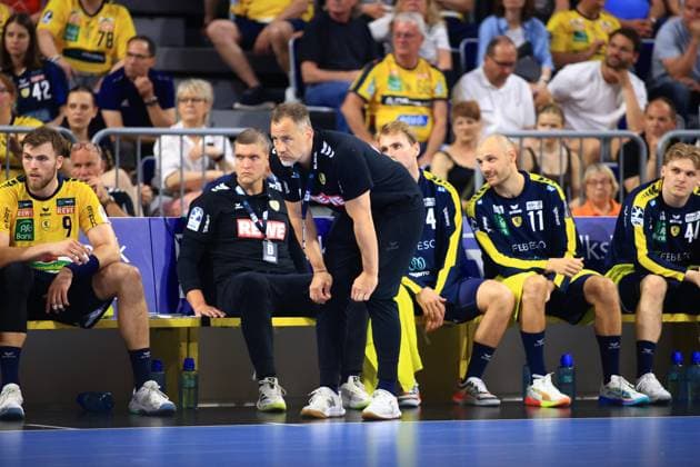 Coach Maik Machulla leans forward on the Rhein Neckar Löwen substitutes bench, with co-coach Michel Abt sitting next to him Steven Plucnar Jacobsen 9 and Lukas Sandell 11 can also be seen on the bench Maik Machulla and Michel Abt on the Rhein Neckar Löwen touchline Copyright: xspeedshotx