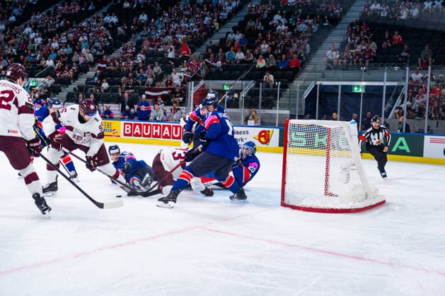 ZURICH, SWITZERLAND - MAY 24: Cade Neilson (Great Britain, 94) trying to stop Oskars Batna (Latvia, 95) during the Preliminary Round - Group A Match 43 between Great Britain and Latvia at the IIHF Ice hockey, Eishockey World Championship, WM, Weltmeisterschaft 2026, Swiss Life Arena on May 24, 2026 in Zurich, Switzerland. Zurich Switzerland Copyright: xTimoxSteinx