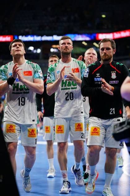 Philipp Weber 20 and Albin Lagergren 21 of SC Magdeburg run towards the fans clapping after the match in the SAP Arena On the left is Elvar Örn Jonsson 19 Philipp Weber 20 and Albin Lagergren 21 SC Magdeburg applaud the fans Copyright: xspeedshotx